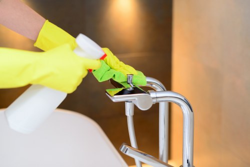 Local cleaner treating stains on a living room sofa