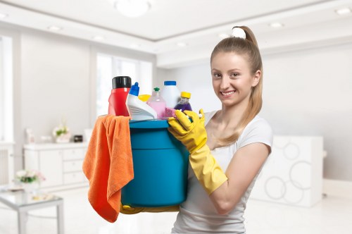 Office cleaning team preparing a clean reception and meeting area in SW6